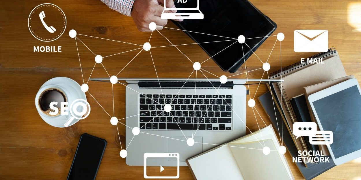 DIGITAL MARKETING new startup project MILLENNIALS Business team hands at work with financial reports and a laptop DIGITAL MARKETING new startup project MILLENNIALS Business team hands at work with financial reports and a laptop