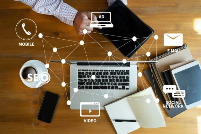 DIGITAL MARKETING new startup project MILLENNIALS Business team hands at work with financial reports and a laptop DIGITAL MARKETING new startup project MILLENNIALS Business team hands at work with financial reports and a laptop
